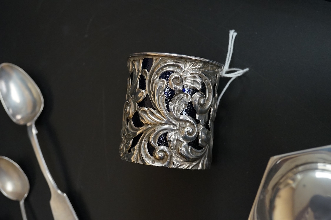 A small group of collectable silver including a pair of modern 925 and lapis lazuli set cocktail stirring spoons, an Edwardian small hexagonal tea caddy, a late Victorian pierced silver salt with blue glass liner and eig